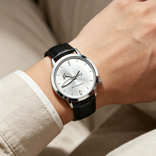 CHOOSZ Lucky Cast silver-dial watch with fishing-themed hands and black leather strap worn with a beige jacket