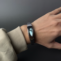 Mercury Drop black dial Y2K futuristic waterdrop watch wrist close-up