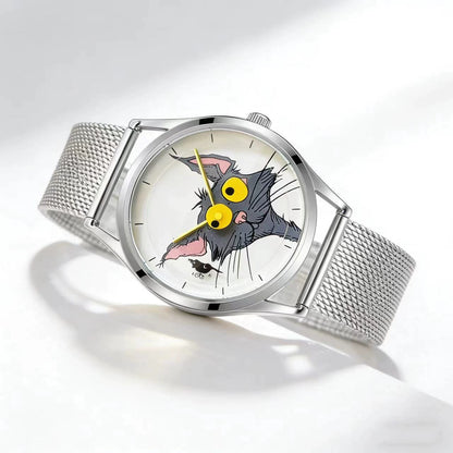 Angled view of Chase Me, Kitty! watch with illustrated cat-and-mouse dial, yellow hands and silver mesh strap on a white surface