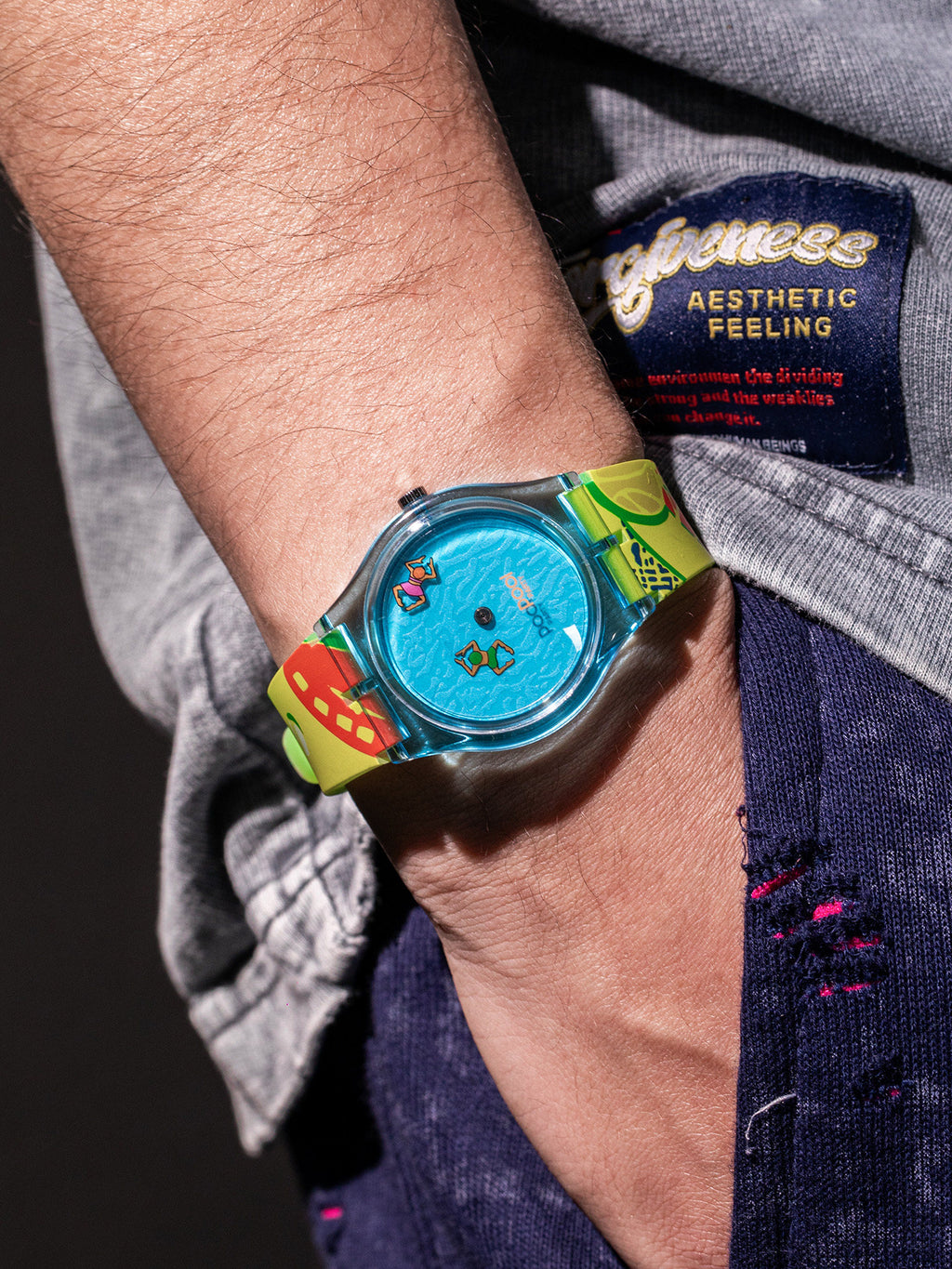 Pool Party translucent blue watch with neon graphic strap worn on wrist