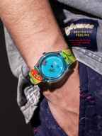 Pool Party translucent blue watch with neon graphic strap worn on wrist