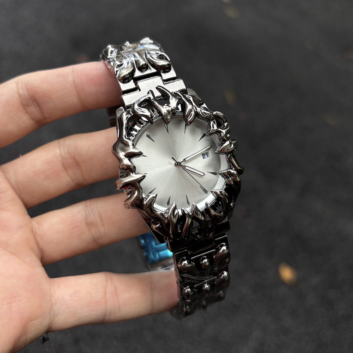 Abyssal Vine silver dial gothic sculpted metal watch handheld close-up
