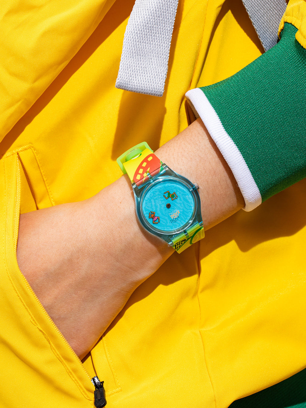 Pool Party translucent blue watch styled with a bright yellow and green outfit