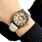 Meow's Wishlist Calico Cat watch with white leather strap worn on the wrist