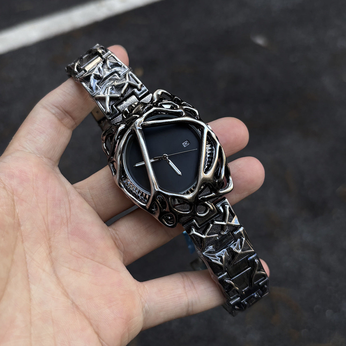 Void Lattice black dial cyberpunk metal cage watch handheld close-up