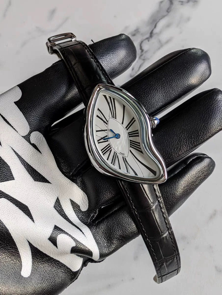 Temporal Distortion silver surrealist asymmetrical watch displayed with accessories