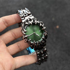 Abyssal Vine green dial gothic sculpted metal watch handheld close-up