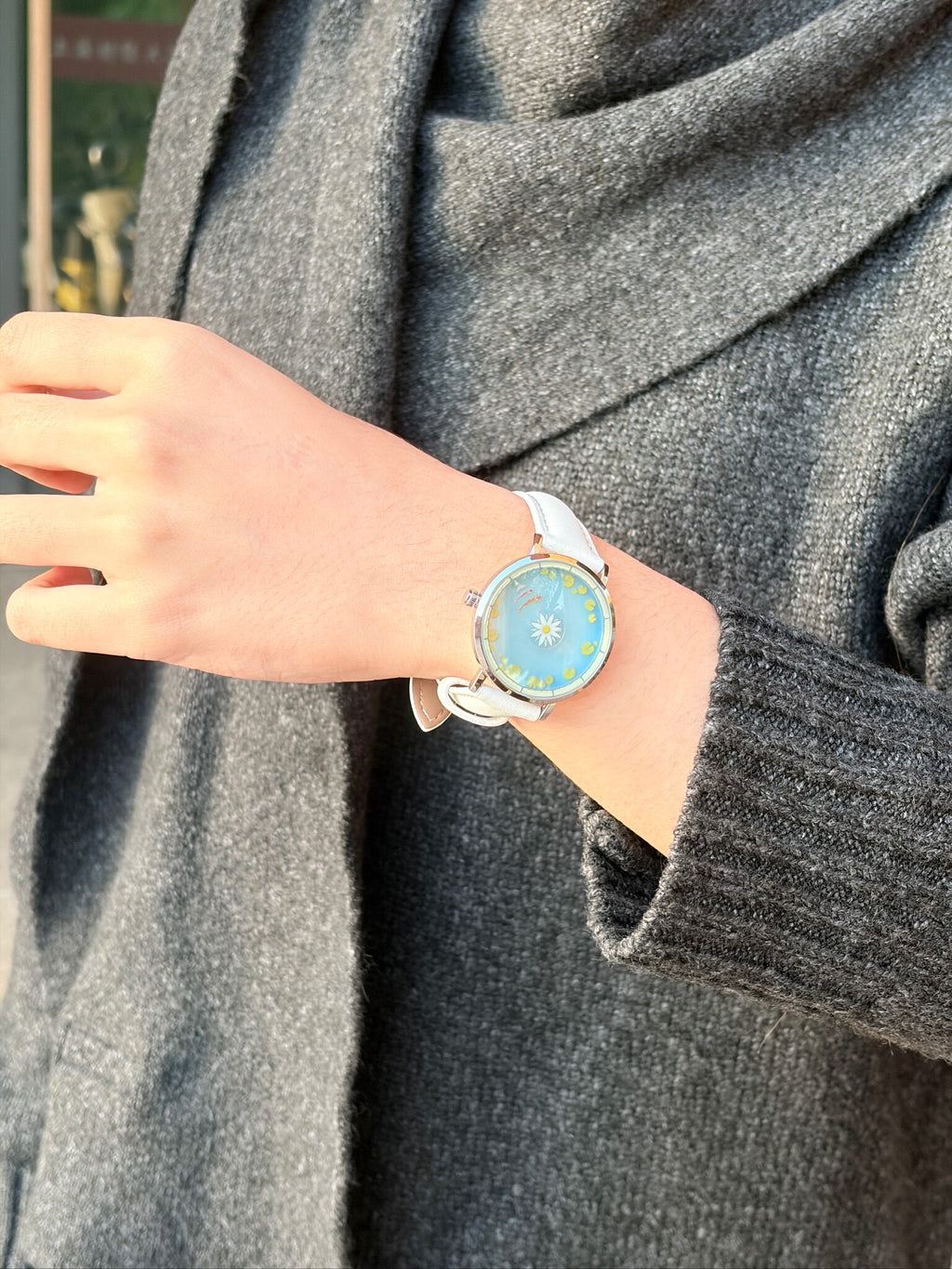 Aqua Animism watch styled on the wrist with a casual outfit