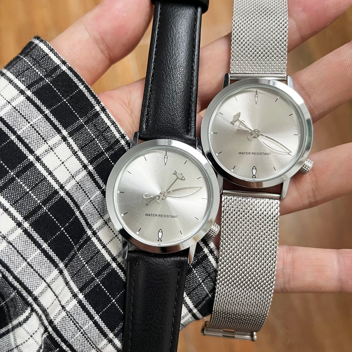 Two CHOOSZ Lucky Cast silver-dial watches held side by side, comparing black leather and silver steel mesh straps