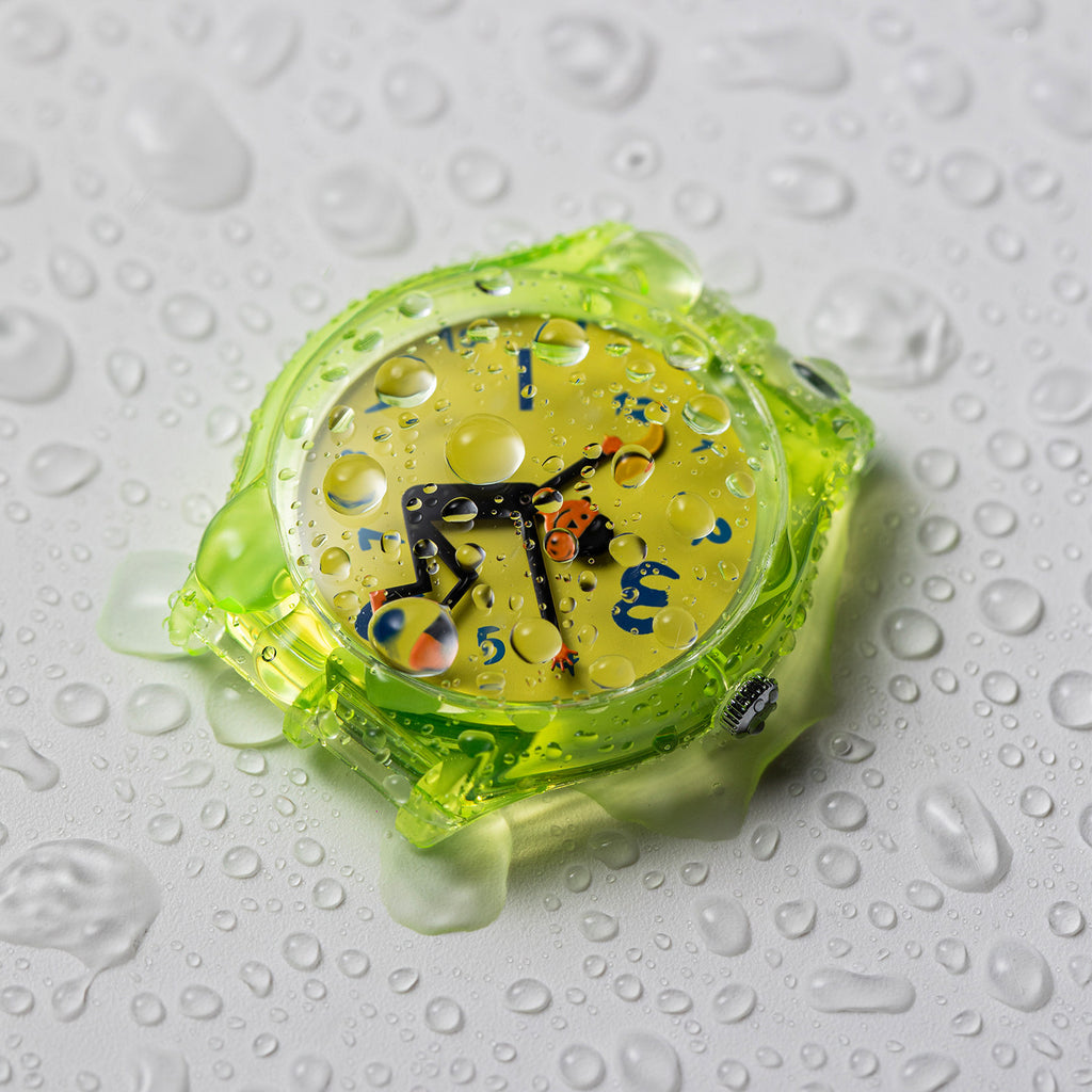 Time Thief translucent neon quartz watch with water droplets demonstrating daily water resistance