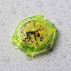 Time Thief translucent neon quartz watch with water droplets demonstrating daily water resistance