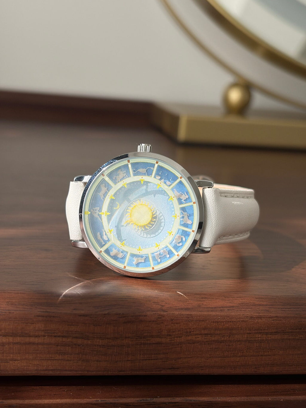Astral Mythos zodiac watch displayed on a wooden surface