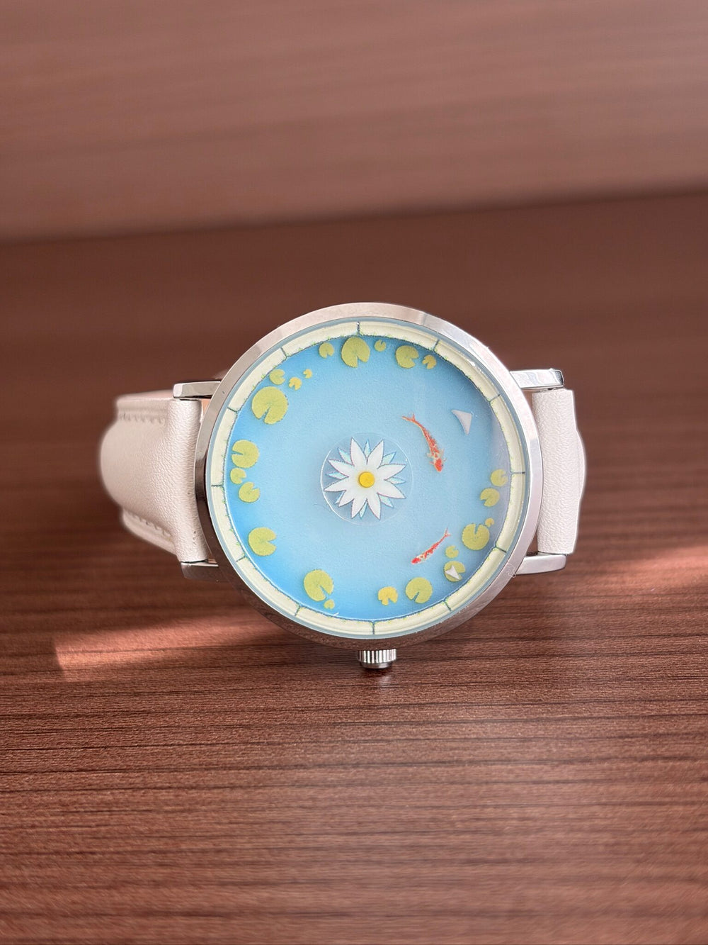 Close view of the Aqua Animism lotus, koi and custom time indicators
