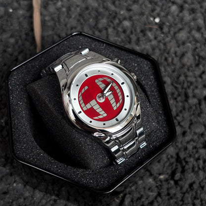 CHOOSZ Pulse Orbit red-dial hybrid watch with silver steel bracelet resting in a black foam-lined presentation tin
