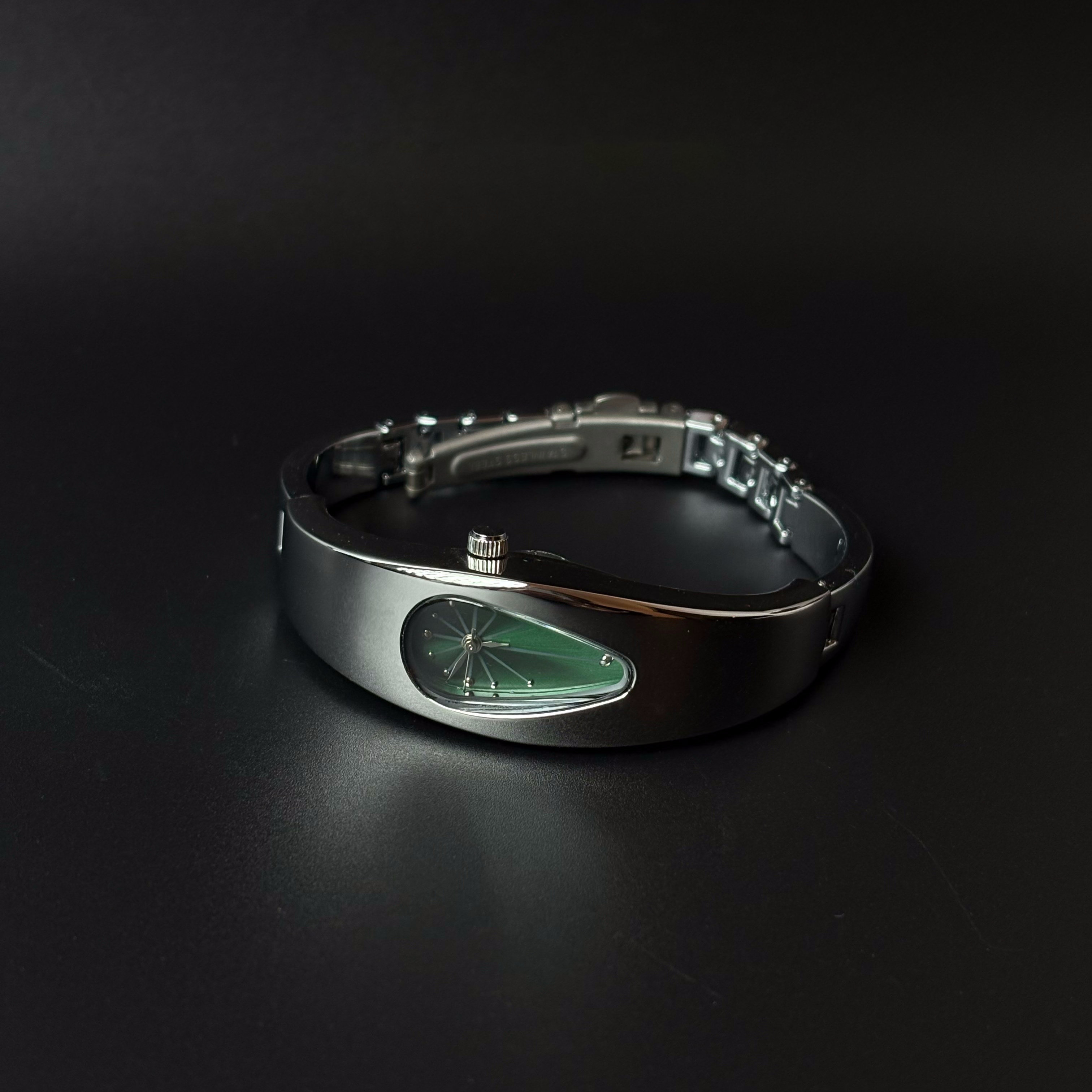 Mercury Drop green dial Y2K futuristic waterdrop watch angled view