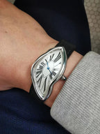 Temporal Distortion silver surrealist asymmetrical watch worn on wrist