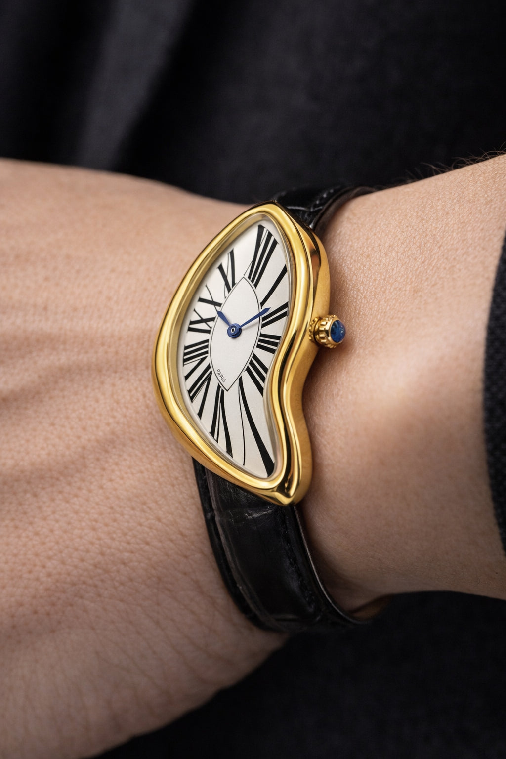 Temporal Distortion gold surrealist asymmetrical watch worn on wrist