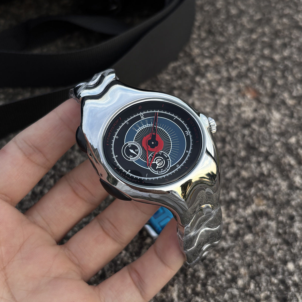 Chrono Flux red Y2K futuristic analog watch handheld close-up