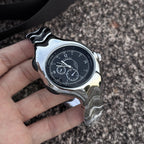 Chrono Flux black Y2K futuristic analog watch handheld close-up