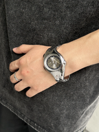Chrono Flux silver Y2K futuristic analog watch worn on wrist