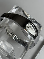 Mercury Drop silver dial Y2K metal watch worn on wrist