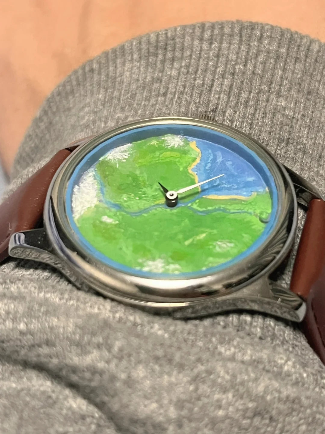 Nature's Orbit early prototype with painted landscape, conventional hands and brown leather strap