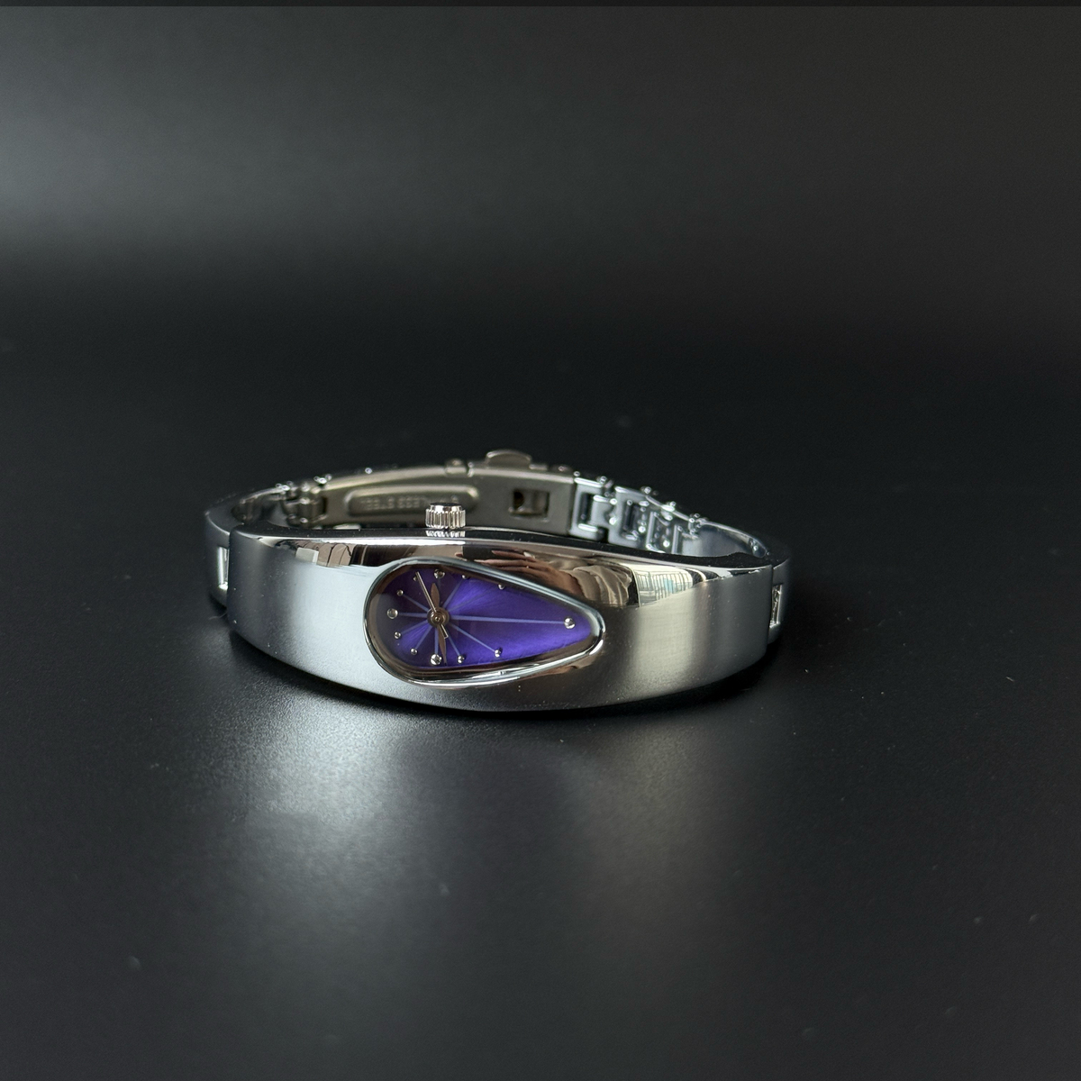 Mercury Drop purple dial Y2K futuristic waterdrop watch angled view
