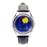 CHOOSZ The Golden Chase watch with blue castle-and-moon dial, flying character details, silver case and black leather strap