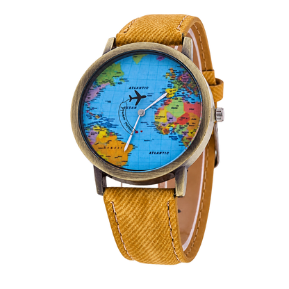 CHOOSZ Wander Orbit watch with blue world-map dial, airplane-shaped seconds hand, antique gold-tone case and mustard yellow textured strap