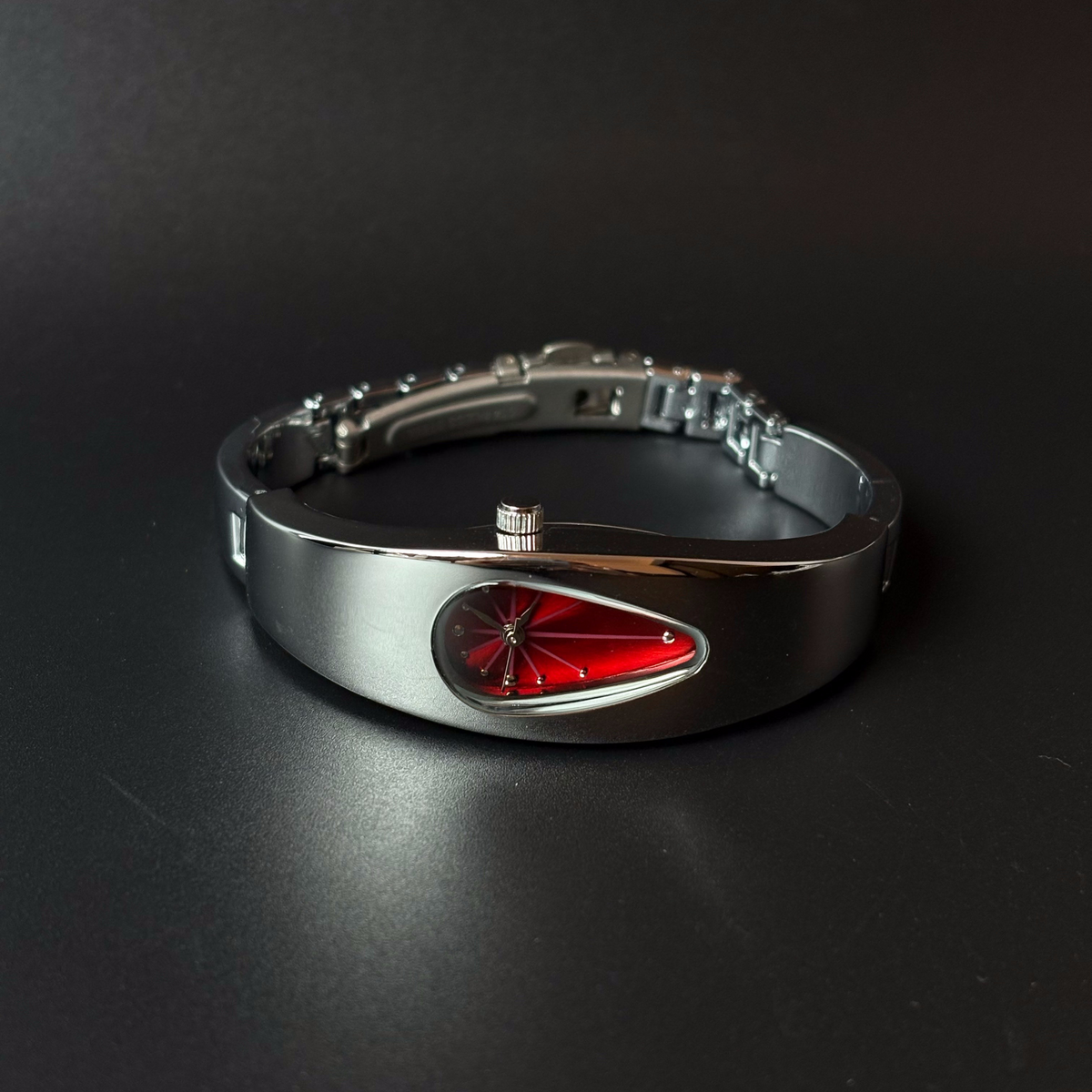 Mercury Drop red dial Y2K futuristic waterdrop watch angled view