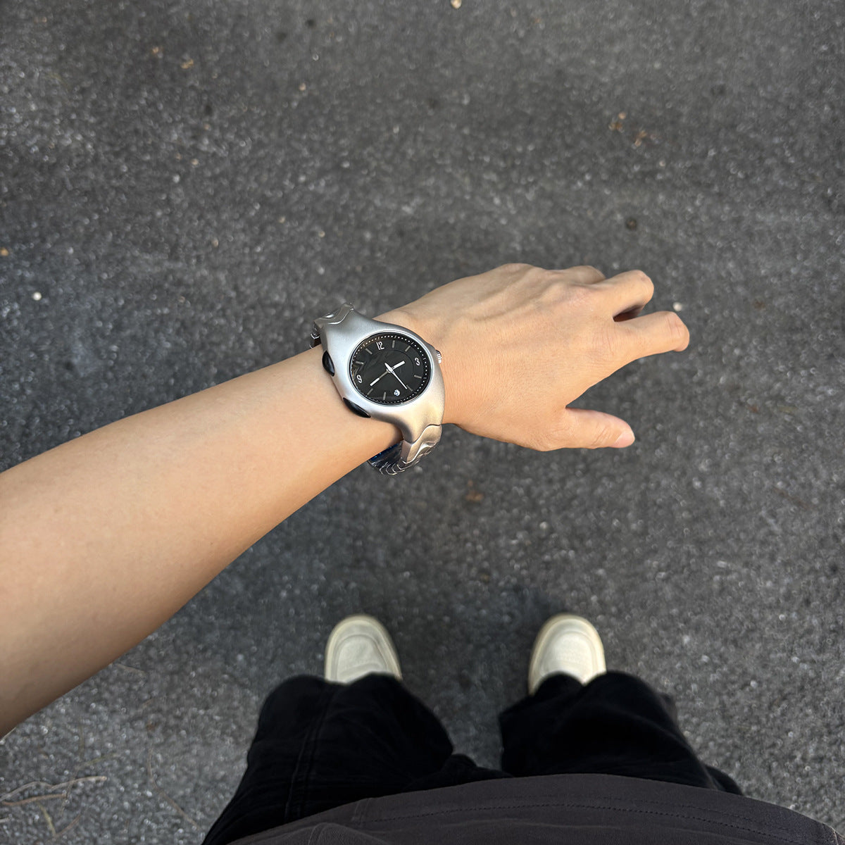 Chrome Ripple silver Y2K statement watch worn on wrist