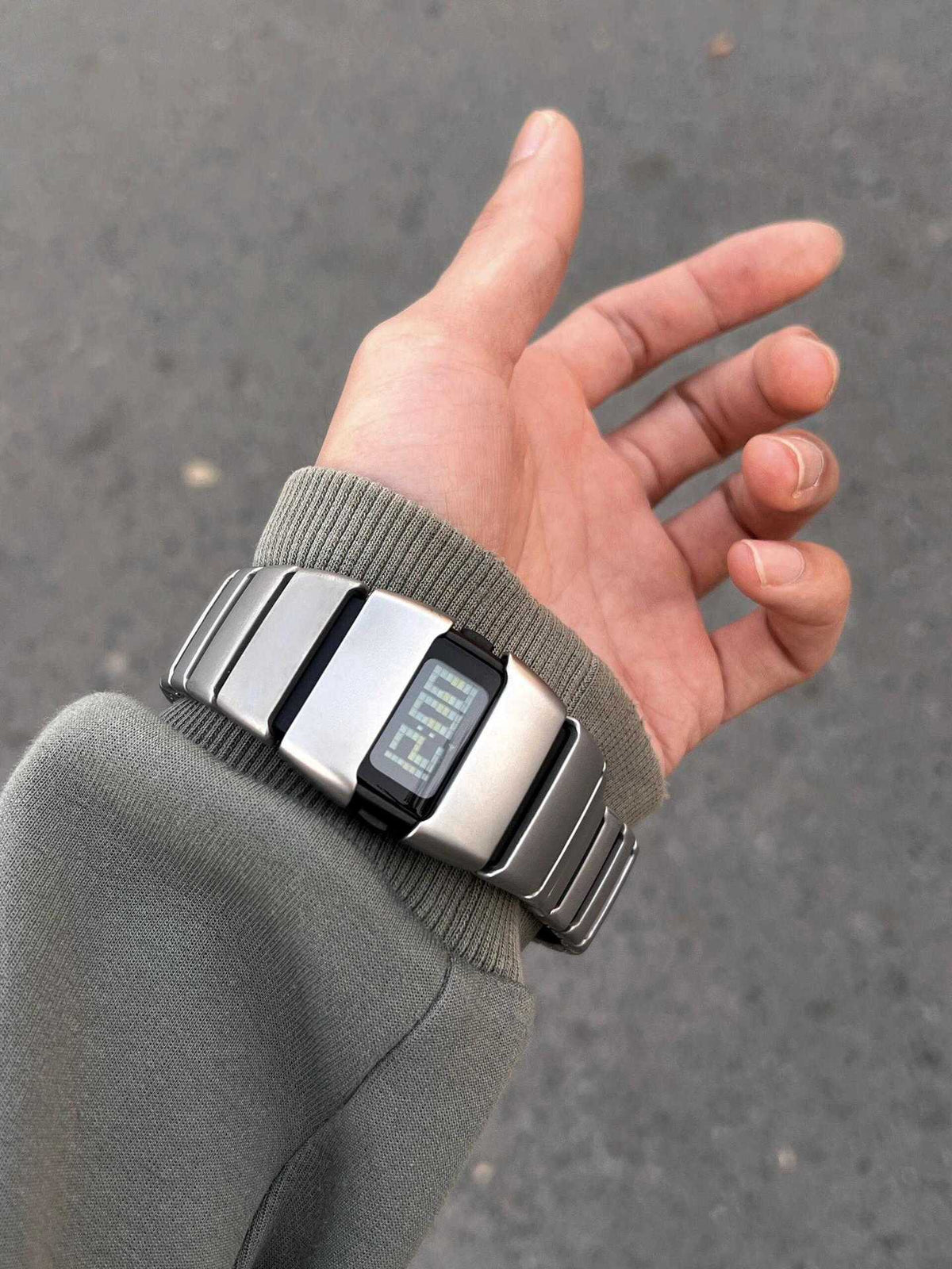 Exoskeleton Link matte silver Y2K futuristic LCD watch worn on wrist