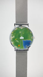 Nature's Orbit watch video demonstrating the Sun hour indicator and Moon minute indicator orbiting the landscape dial