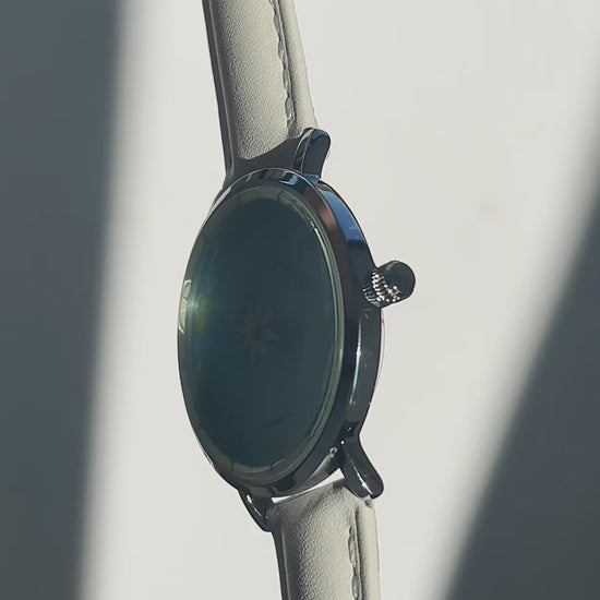 Aqua Animism watch video showing the blue lotus dial and circling koi hour and minute indicators